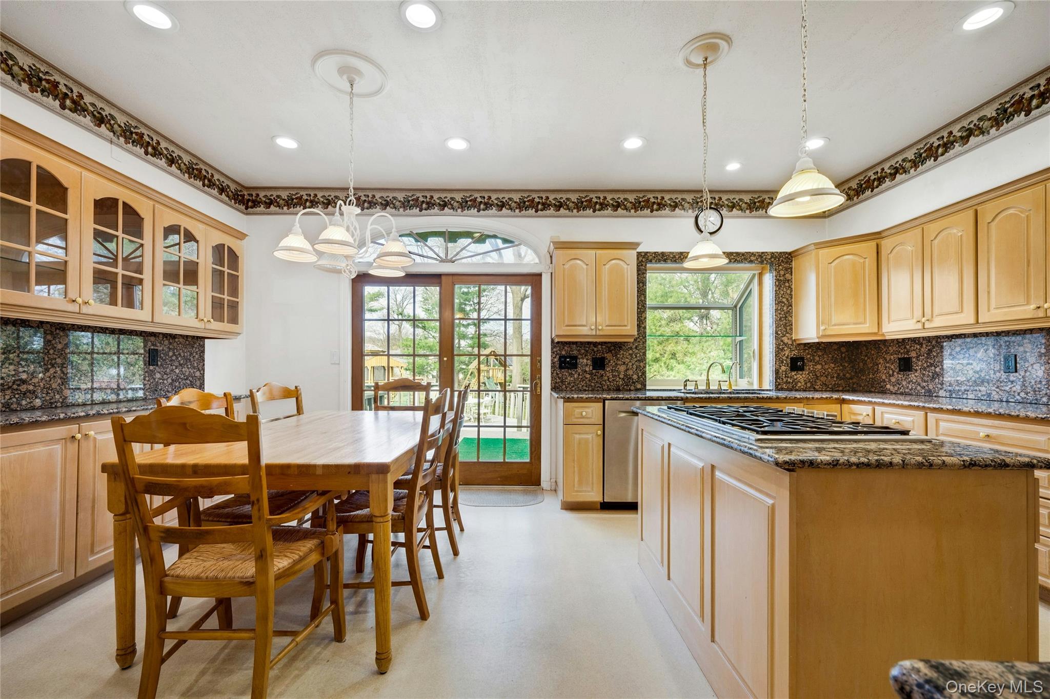 115 Elizabeth Road New Rochelle, NY 10804 - Photo 22 of 47 a kitchen with stainless steel appliances granite countertop a stove and a refrigerator