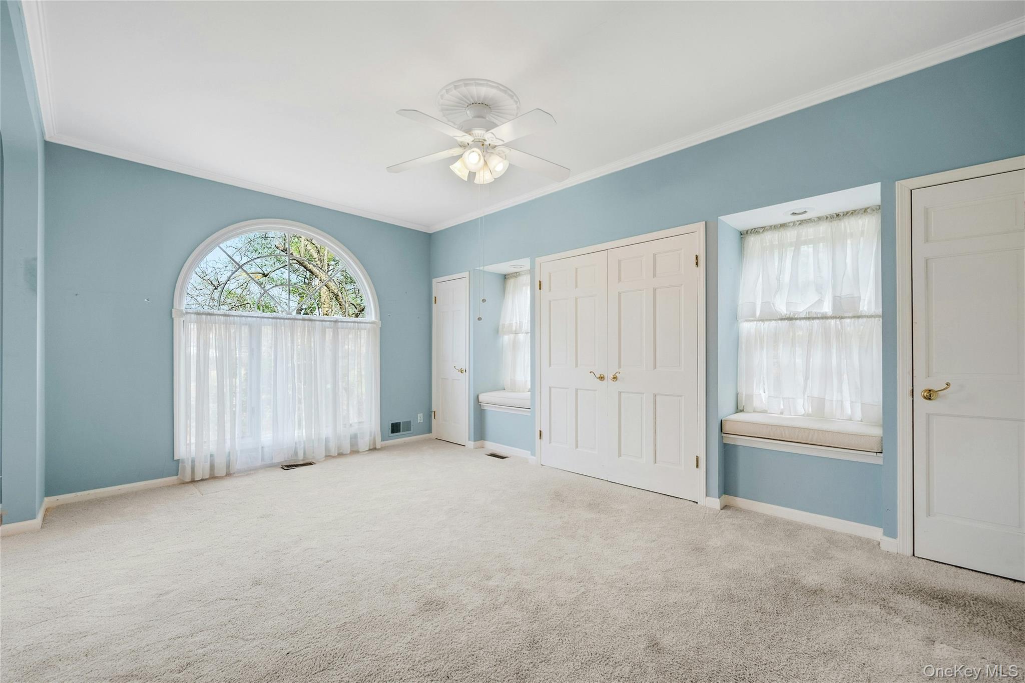 115 Elizabeth Road New Rochelle, NY 10804 - Photo 28 of 47 an empty room with windows and closet