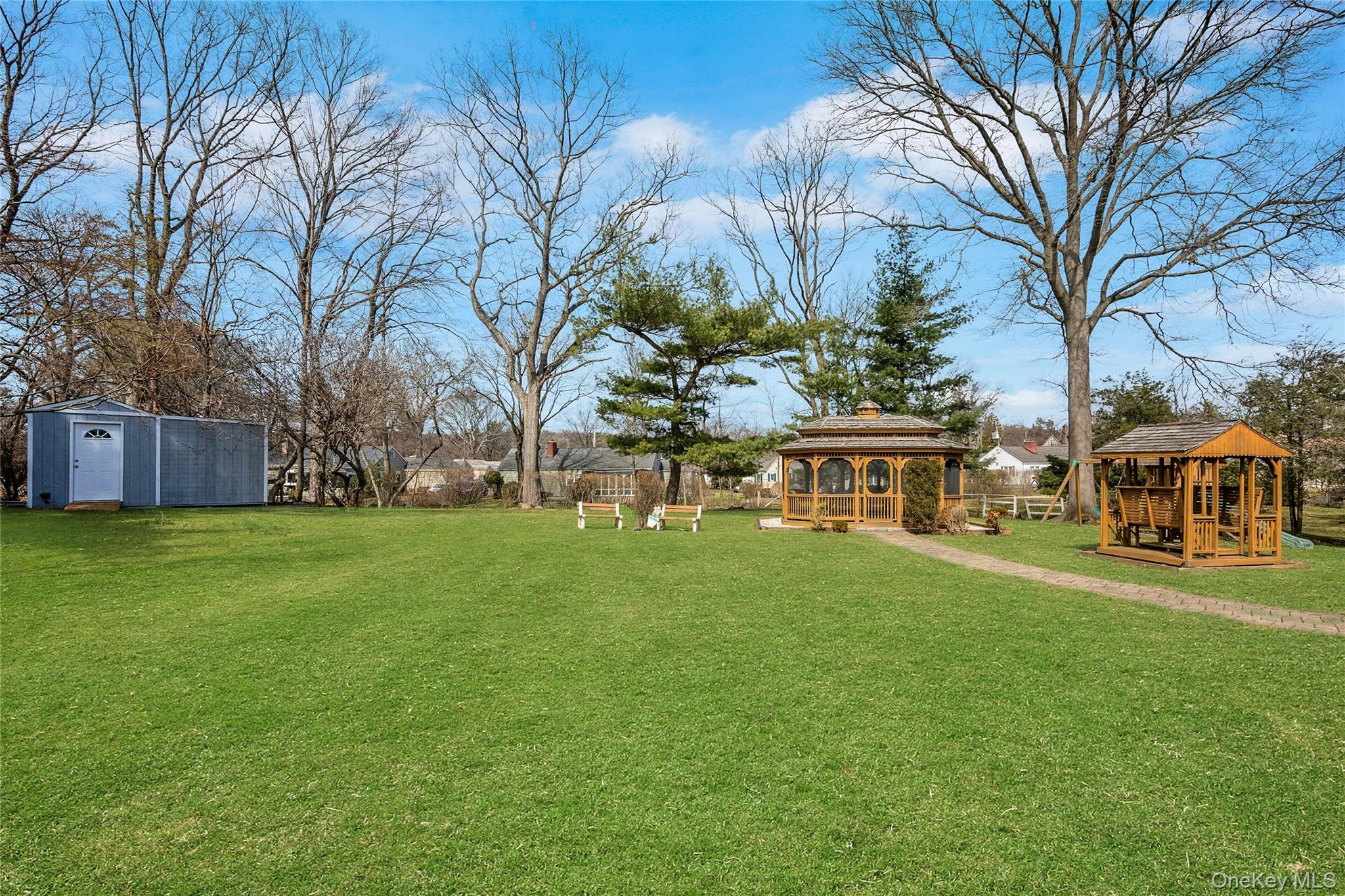 115 Elizabeth Road New Rochelle, NY 10804 - Photo 3 of 47 a view of a house with a big yard