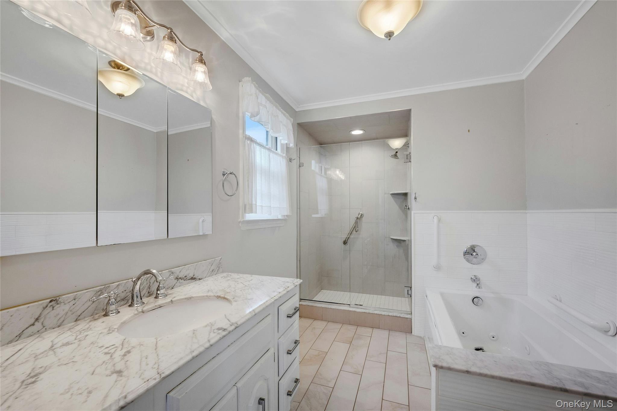 115 Elizabeth Road New Rochelle, NY 10804 - Photo 31 of 47 a bathroom with a sink and a mirror