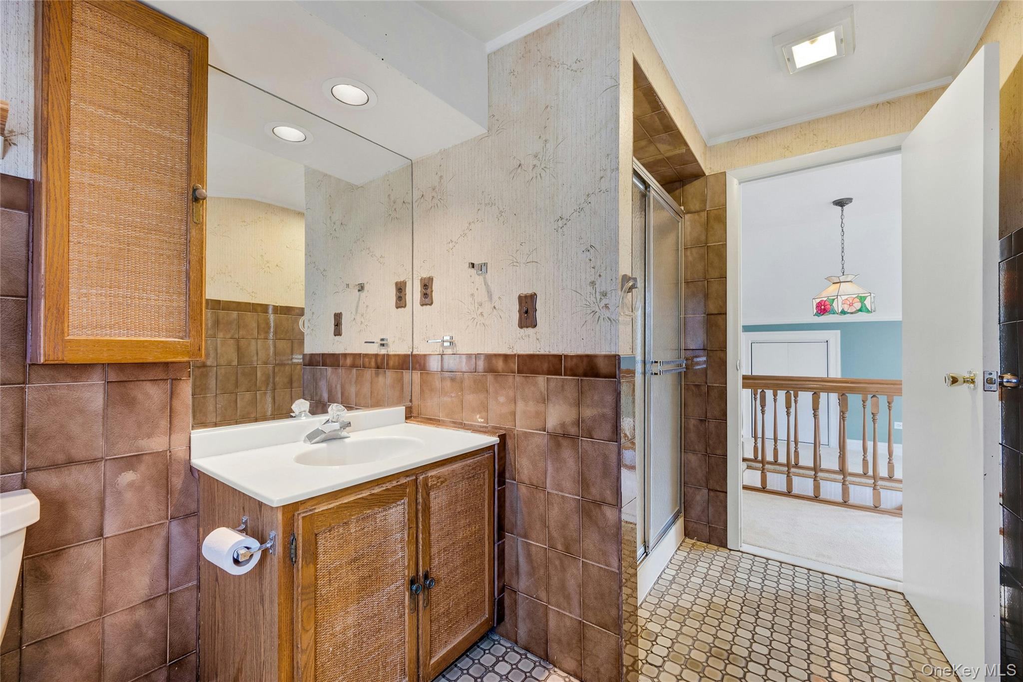 115 Elizabeth Road New Rochelle, NY 10804 - Photo 42 of 47 a bathroom with a sink a toilet and shower