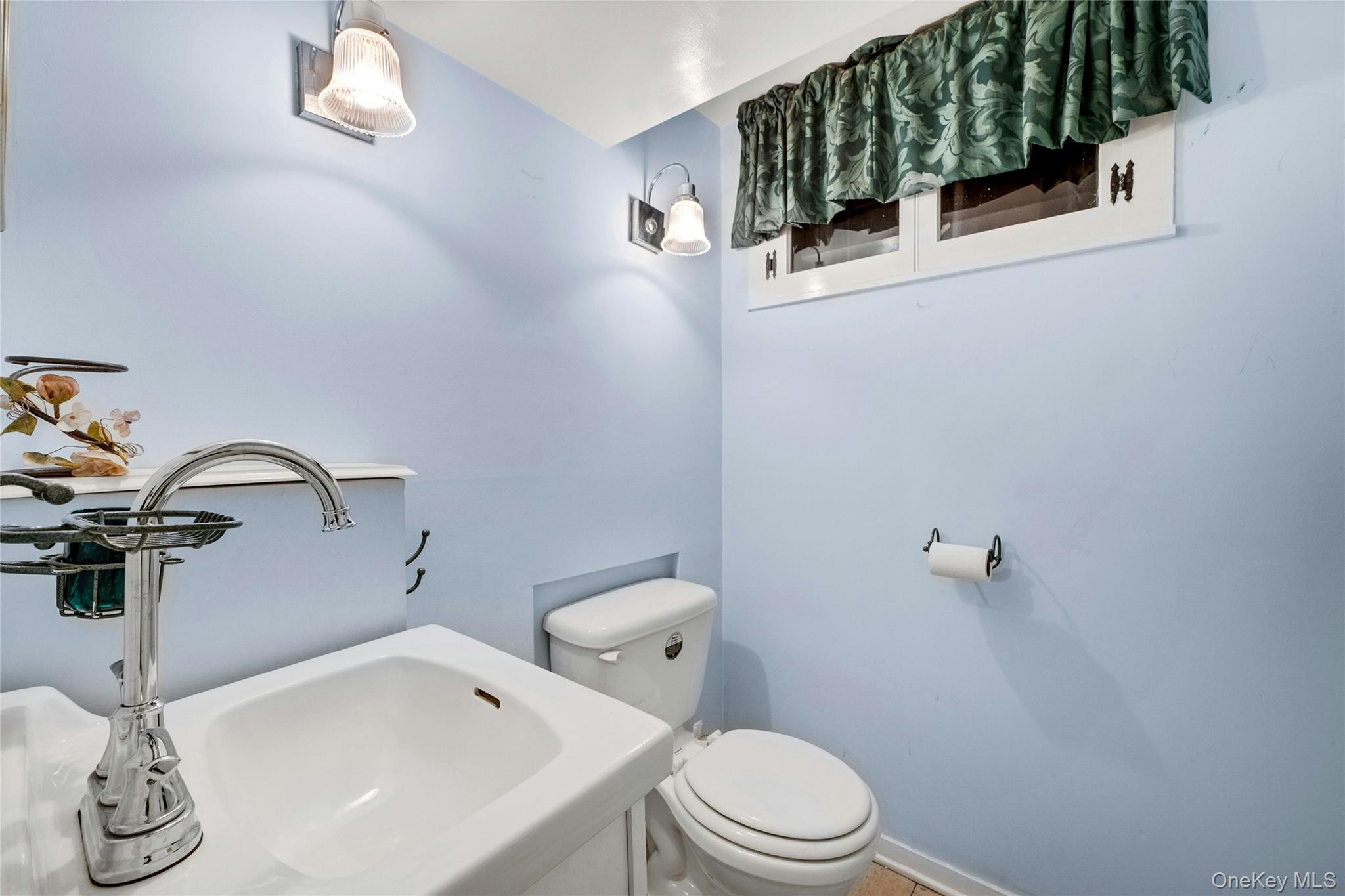 115 Elizabeth Road New Rochelle, NY 10804 - Photo 43 of 47 a bathroom with a sink and a toilet