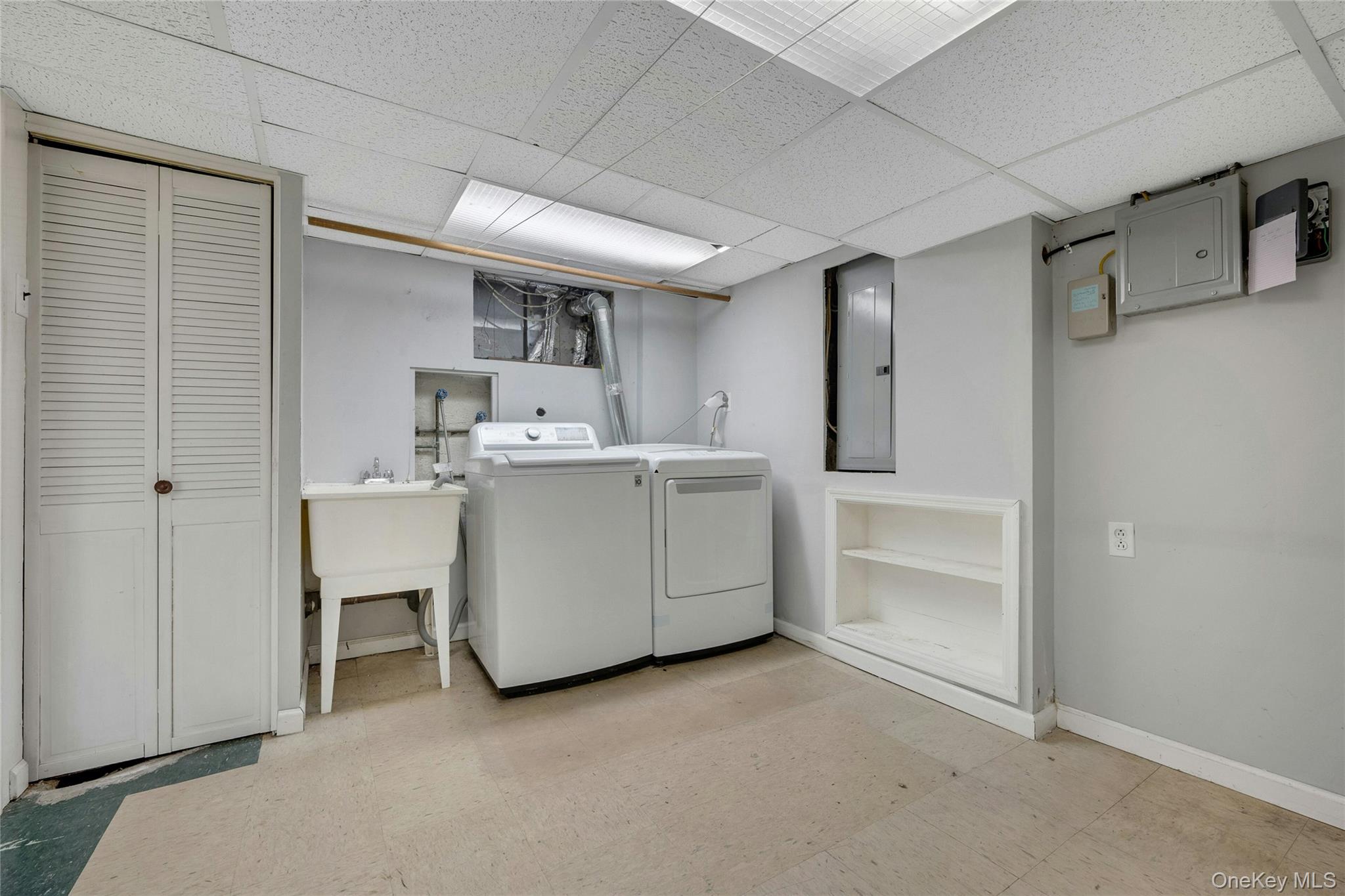 115 Elizabeth Road New Rochelle, NY 10804 - Photo 47 of 47 a utility room with cabinets washer and dryer