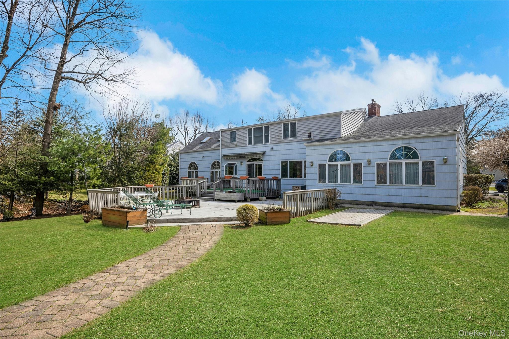 115 Elizabeth Road New Rochelle, NY 10804 - Photo 5 of 47 a view of a house with swimming pool and sitting area