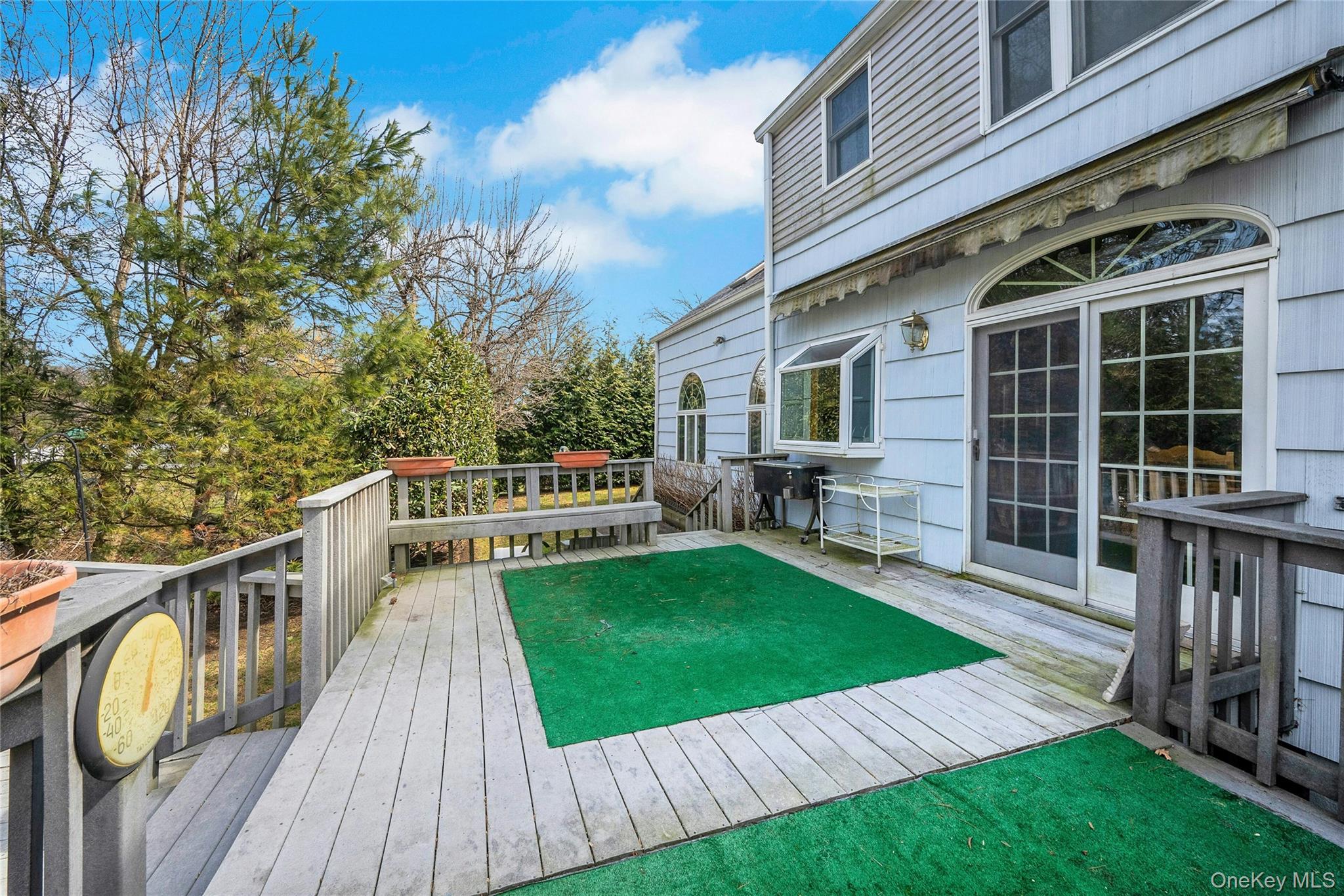 115 Elizabeth Road New Rochelle, NY 10804 - Photo 9 of 47 a view of a house with backyard and wooden deck