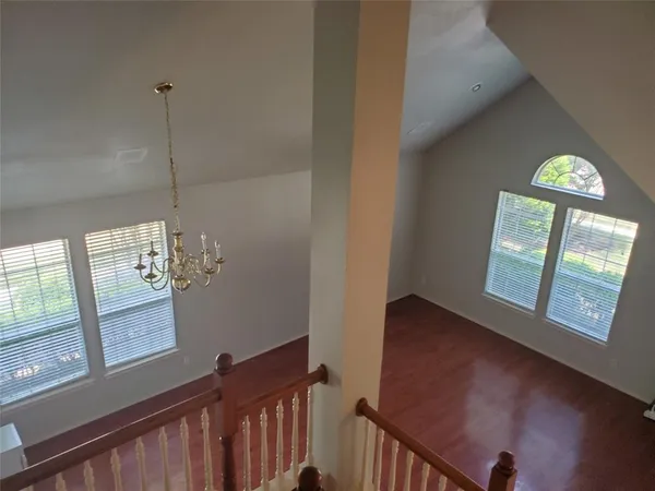 a view of a hallway with windows