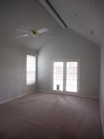 a view of empty room with windows
