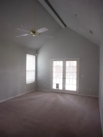 a view of empty room with windows