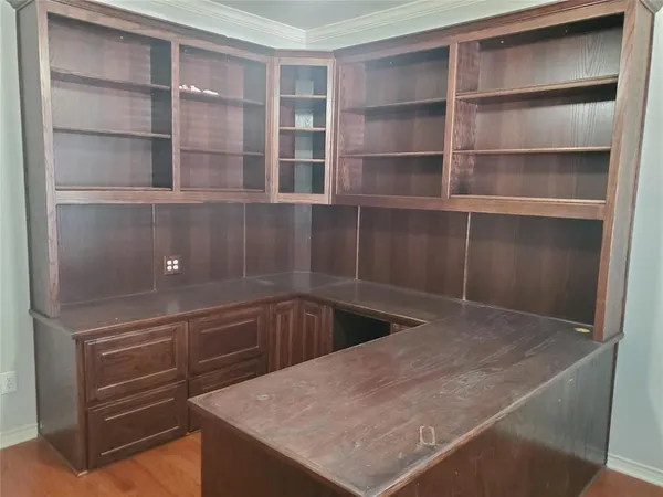 a kitchen with cabinets and window