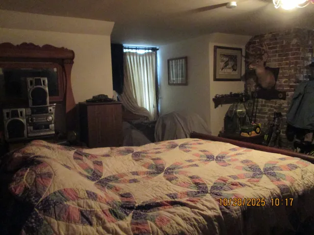 a bedroom with a bed and a mirror