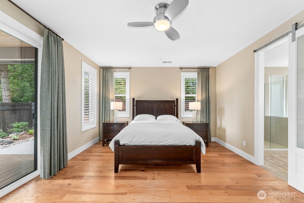 6578 Serenity Loop Gig Harbor, WA 98335 - Photo 14 of 38 a bed sitting in a spacious bedroom next to a window