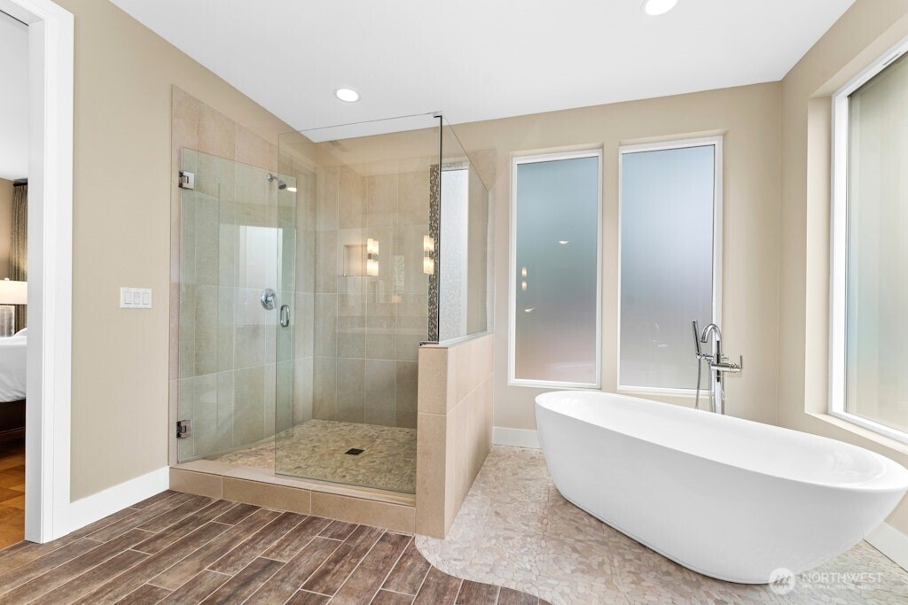 6578 Serenity Loop Gig Harbor, WA 98335 - Photo 18 of 38 a bathroom with a bathtub and a shower