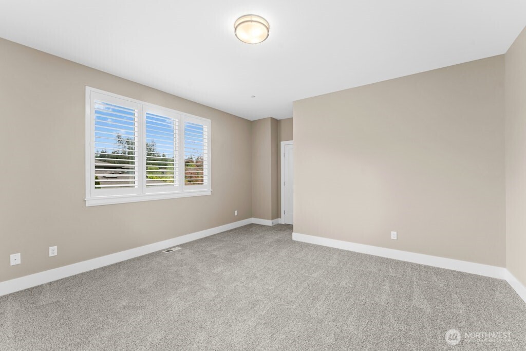 6578 Serenity Loop Gig Harbor, WA 98335 - Photo 27 of 38 an empty room with windows