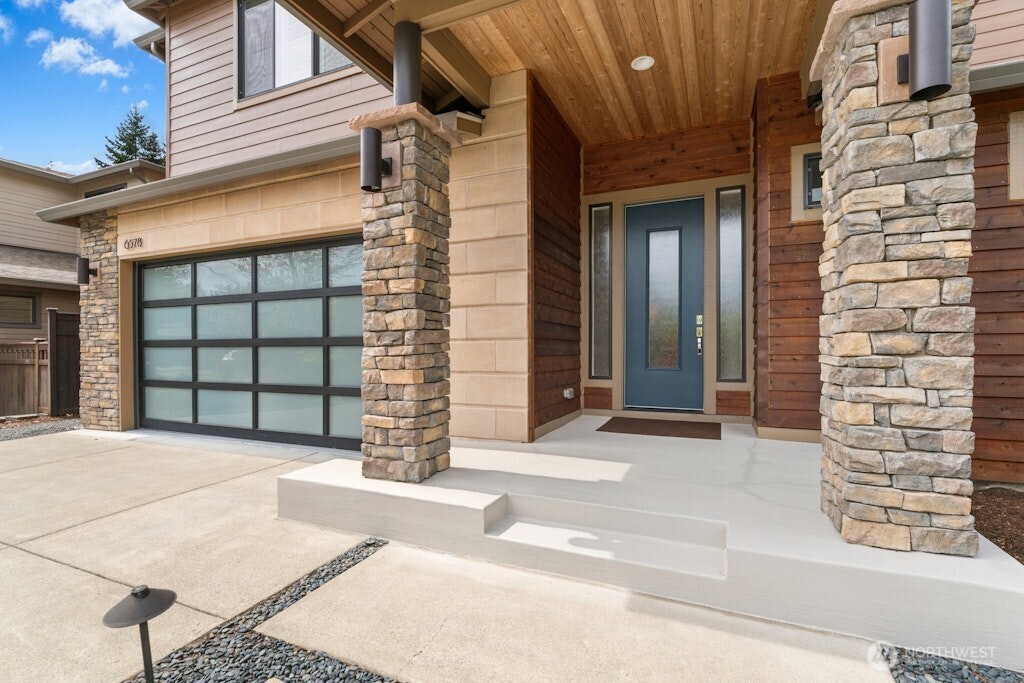6578 Serenity Loop Gig Harbor, WA 98335 - Photo 3 of 38 a front view of a house with a garage