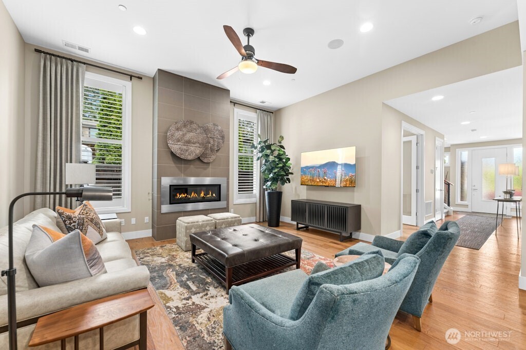 6578 Serenity Loop Gig Harbor, WA 98335 - Photo 5 of 38 a living room with fireplace furniture and a large window
