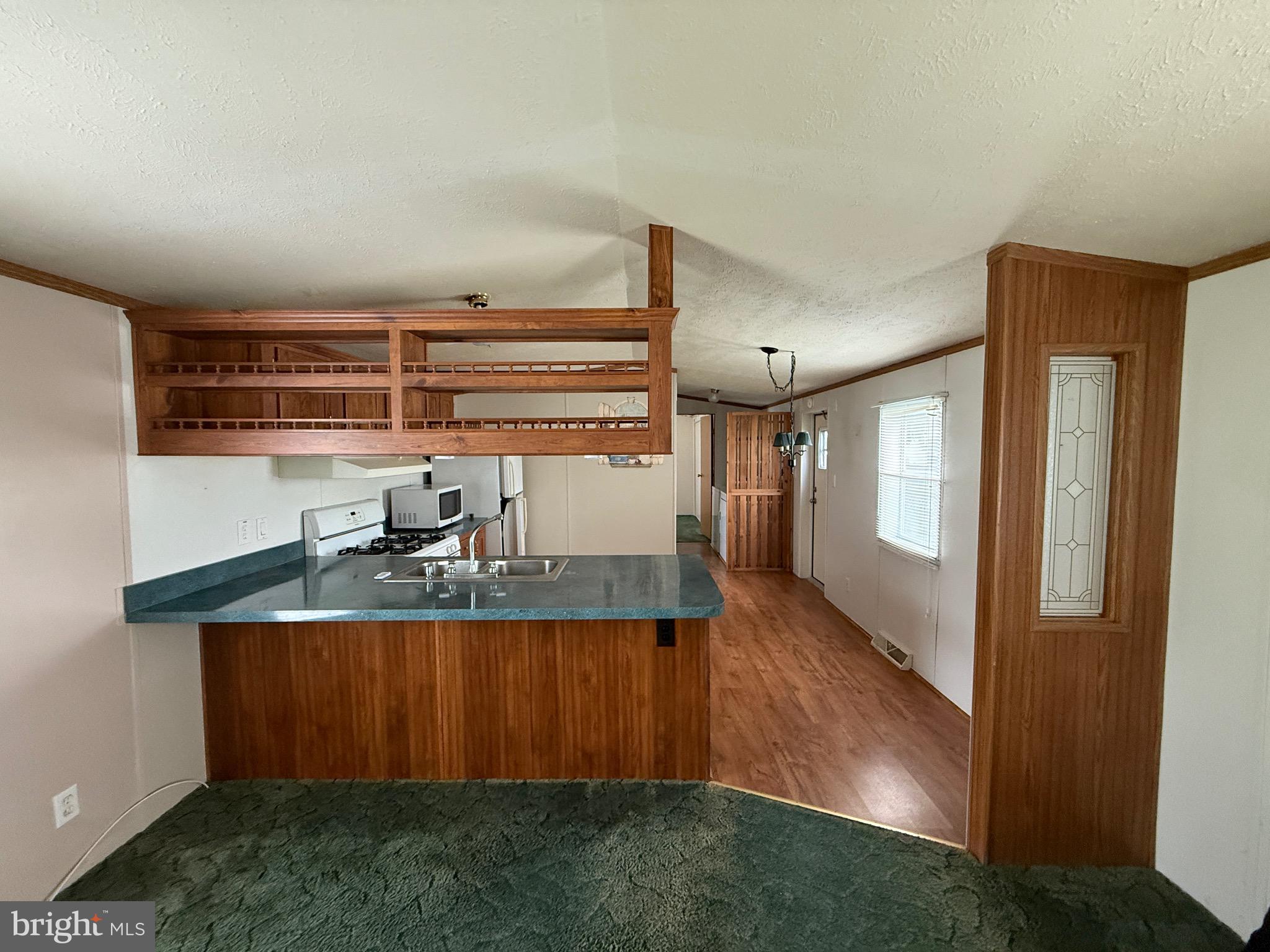 9241 Clare Circle Delmar, MD 21875 - Photo 13 of 30 a kitchen with kitchen island a counter top space and a sink