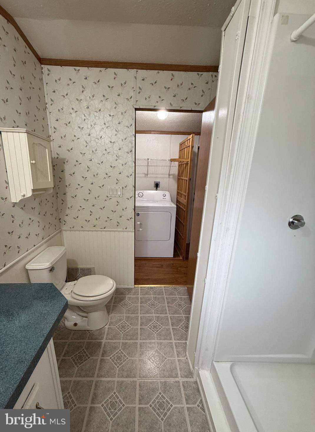 9241 Clare Circle Delmar, MD 21875 - Photo 16 of 30 a bathroom with a granite countertop bathtub and toilet