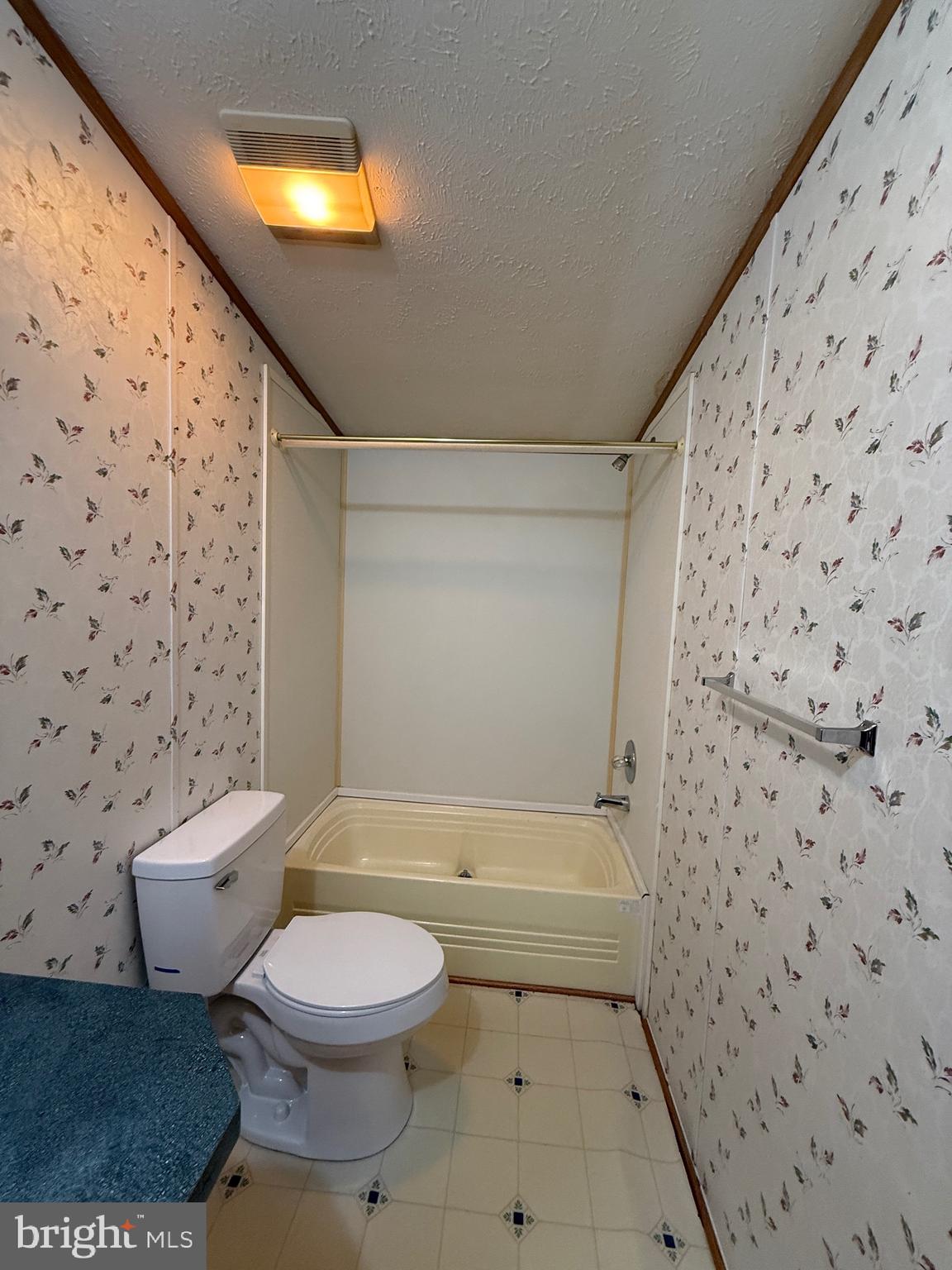 9241 Clare Circle Delmar, MD 21875 - Photo 27 of 30 a bathroom with a toilet and a shower curtain
