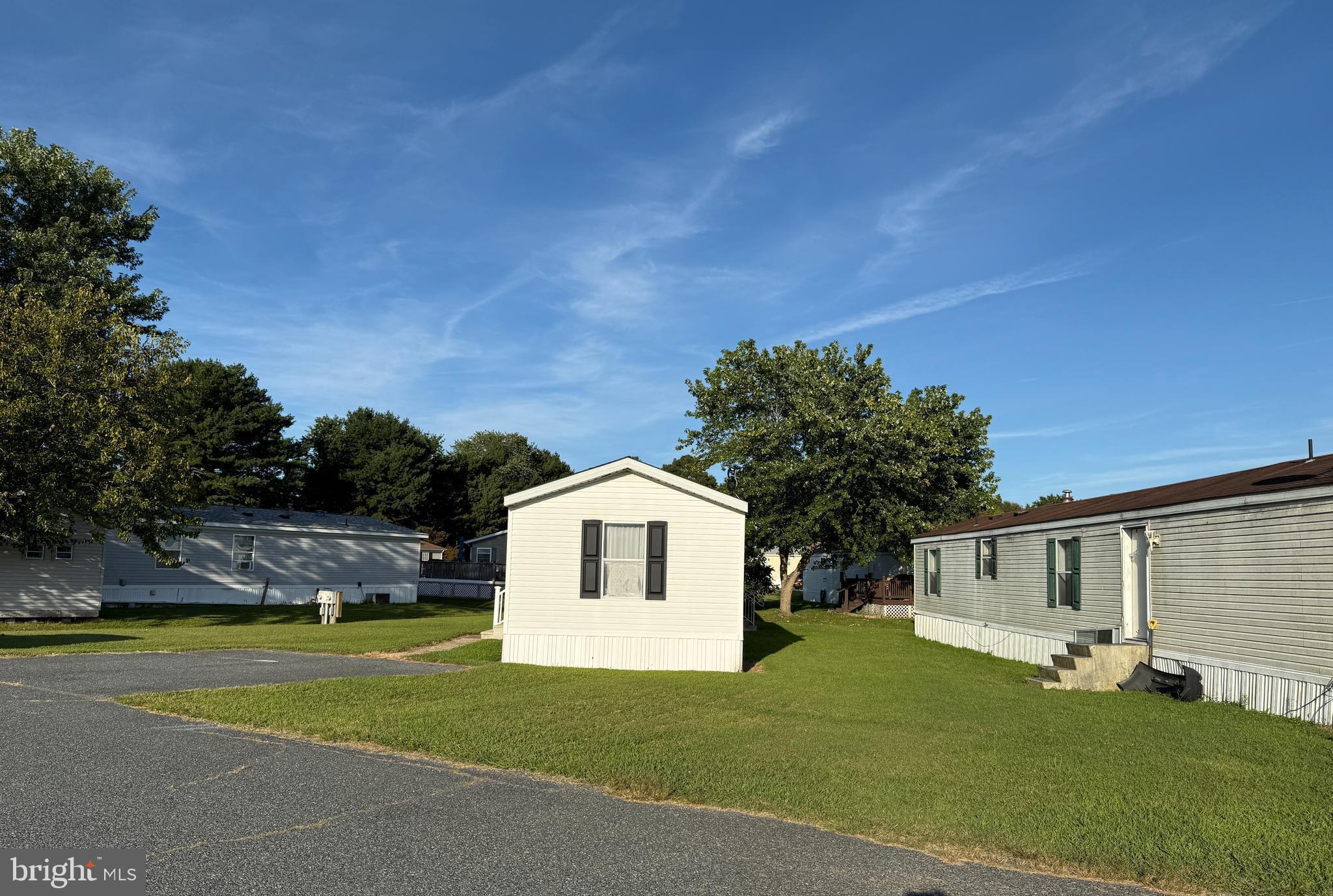 9241 Clare Circle Delmar, MD 21875 - Photo 3 of 30 a front view of a house with garden