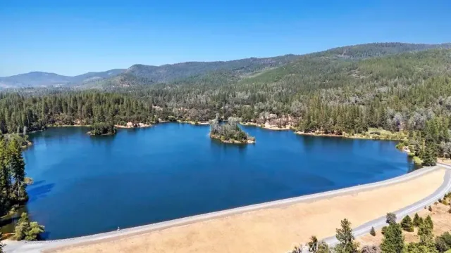 a view of a mountain from a yard