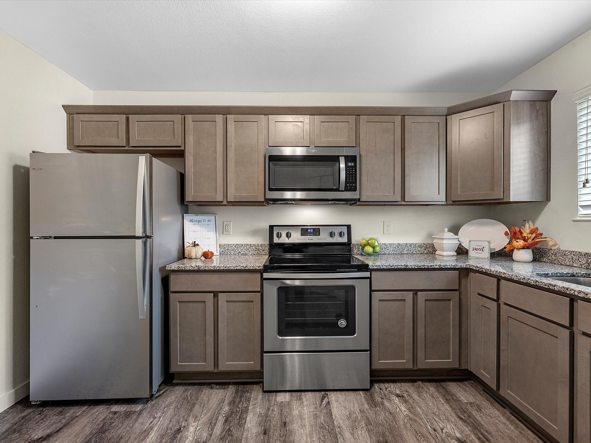 21155 Gosling Road, Unit 20A Spring, TX 77388 - Photo 3 of 37 a kitchen with stainless steel appliances granite countertop a refrigerator stove a sink and a microwave