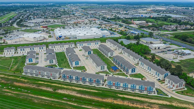 an aerial view of a city with beds and ocean view