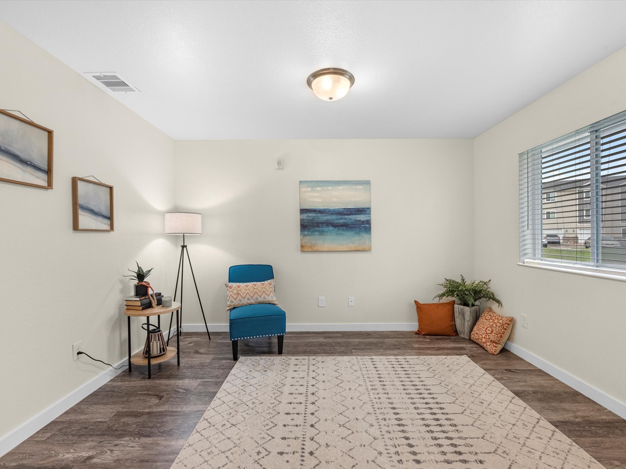 21155 Gosling Road, Unit 20A Spring, TX 77388 - Photo 7 of 37 a bedroom with a bed and wooden floor