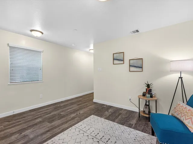 a room with furniture and wooden floor