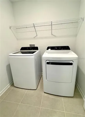 a bedroom with a bed window and wall painting