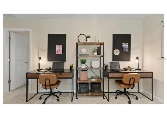 a view of a room with lots of gym equipment