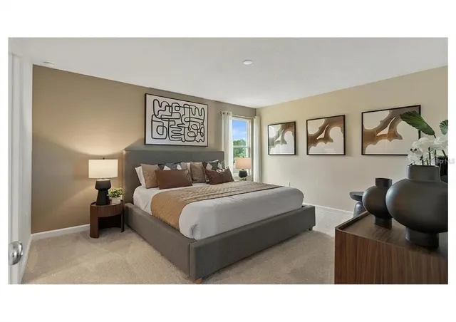 an aerial view of a house with a garden and lake view