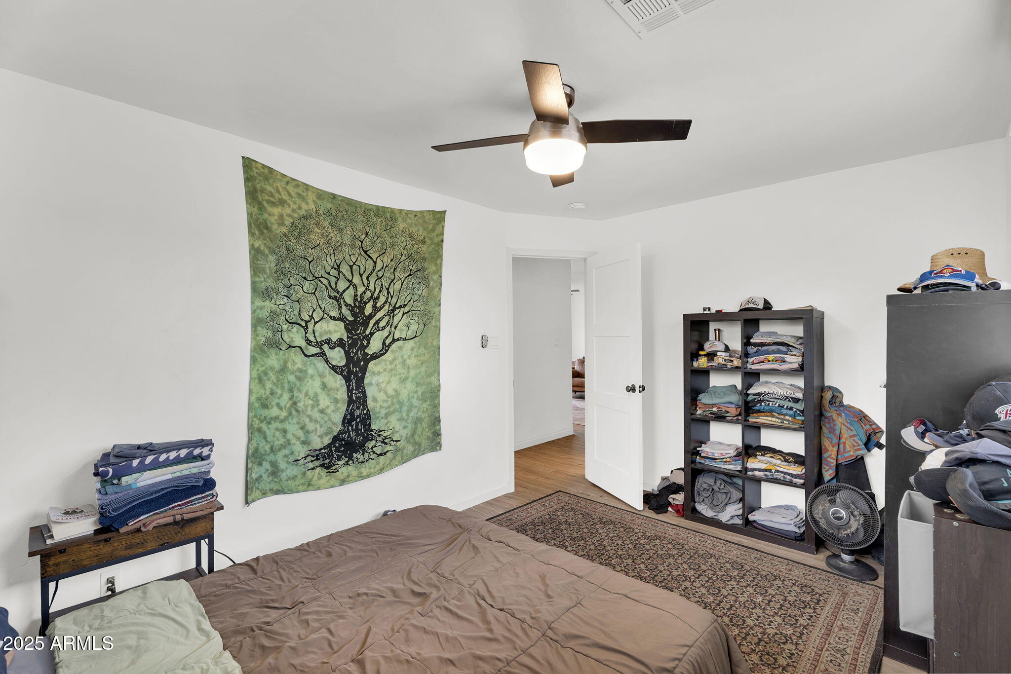2434 North 37th Way Phoenix, AZ 85008 - Photo 9 of 17 a bedroom with a bed and a window
