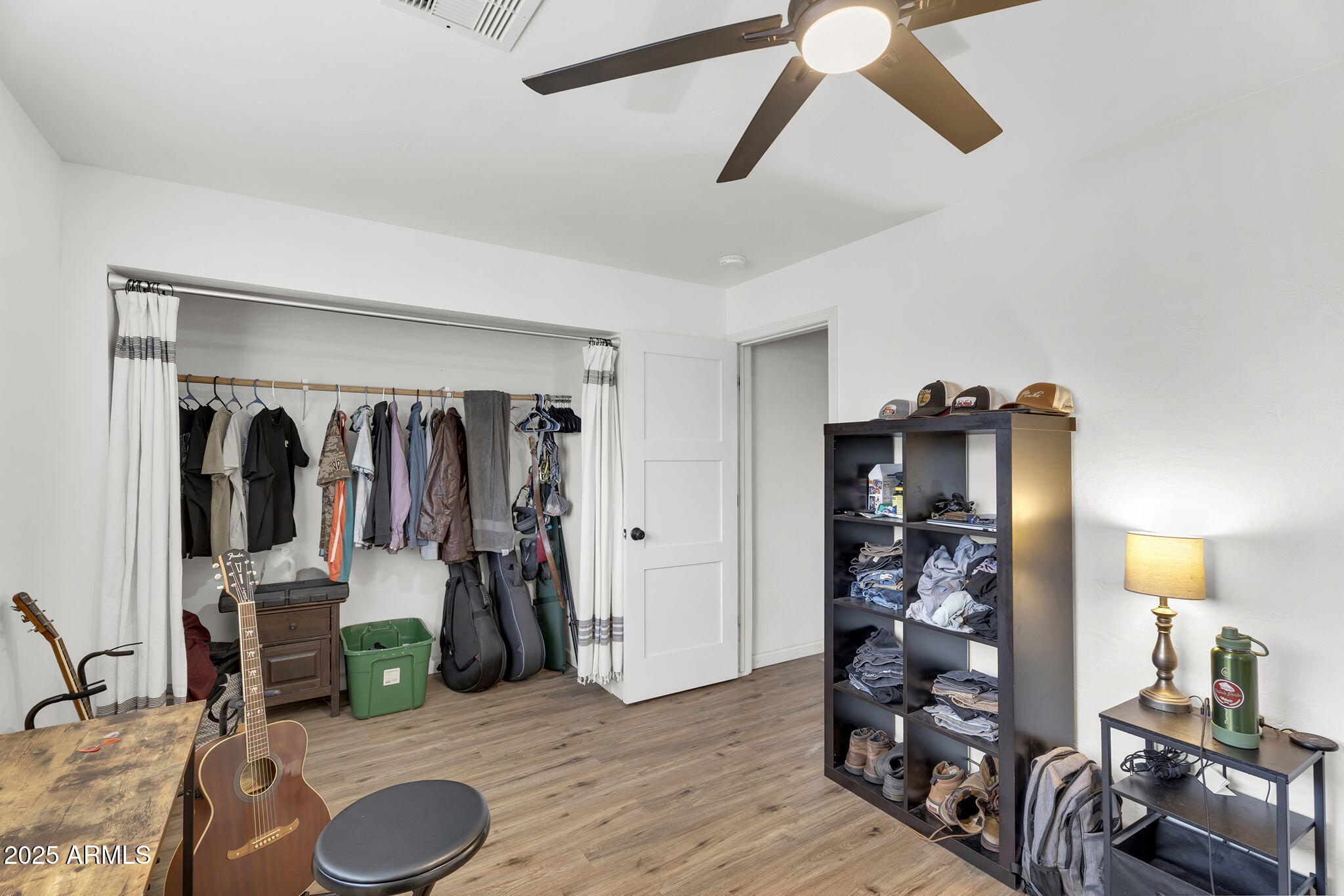 2434 North 37th Way Phoenix, AZ 85008 - Photo 11 of 17 a view of a livingroom with furniture and a ceiling fan