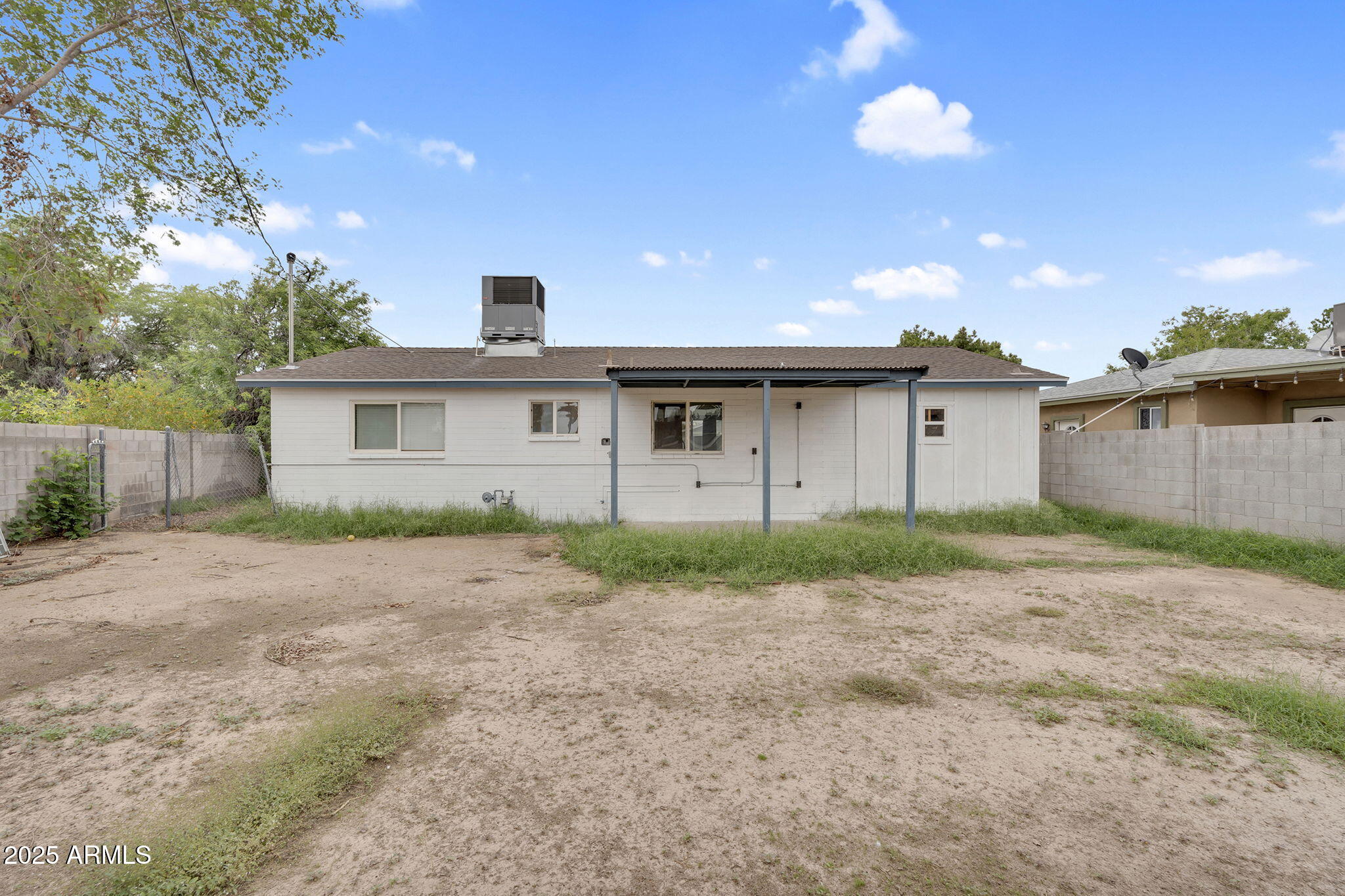 2434 North 37th Way Phoenix, AZ 85008 - Photo 14 of 17 a front view of a house with a yard and garage