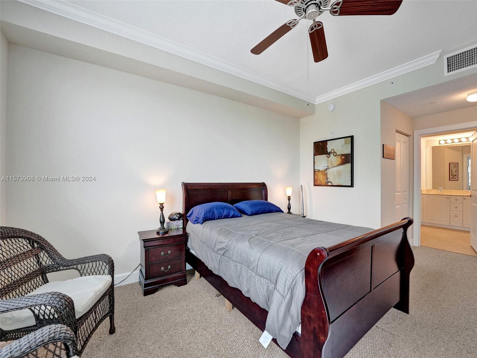 1660 Renaissance Commons Boulevard, Unit 2508 Boynton Beach, FL 33426 - Photo 14 of 28 a bedroom with a bed couch and window
