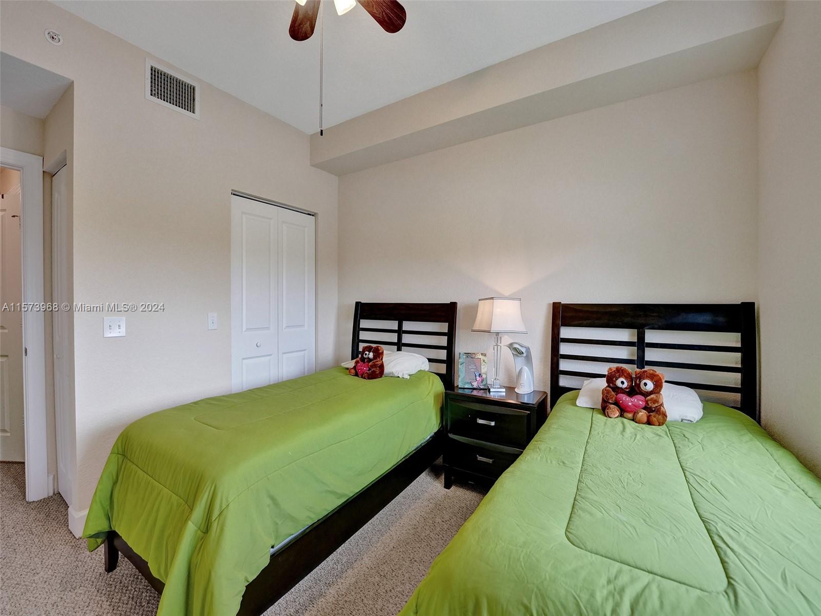 1660 Renaissance Commons Boulevard, Unit 2508 Boynton Beach, FL 33426 - Photo 17 of 28 a bedroom with a bed and wooden floor
