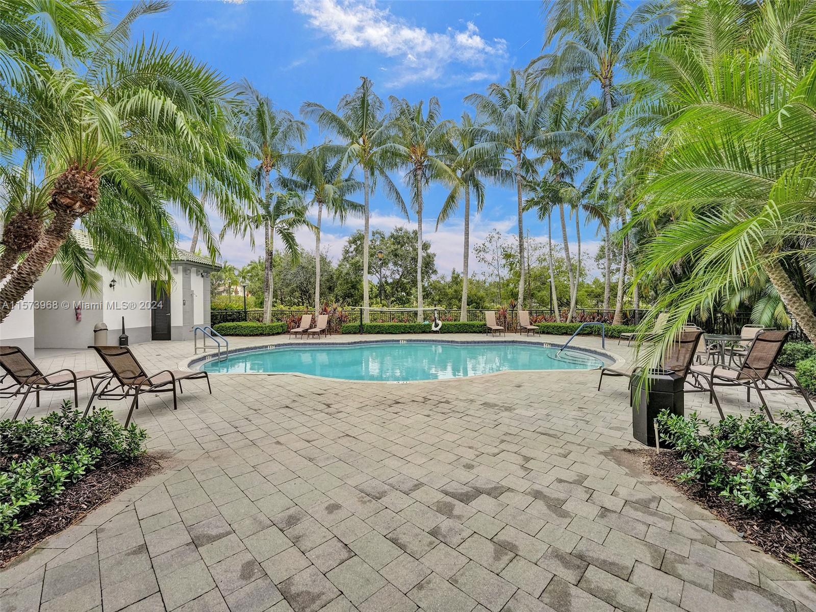 1660 Renaissance Commons Boulevard, Unit 2508 Boynton Beach, FL 33426 - Photo 20 of 28 a view of a yard with a slide