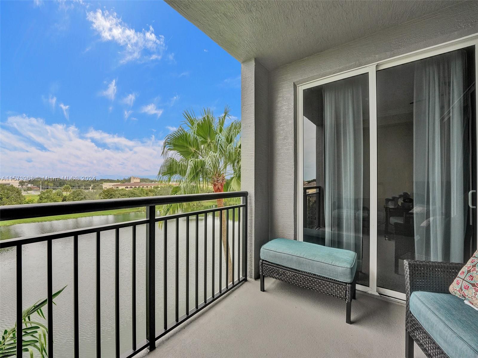1660 Renaissance Commons Boulevard, Unit 2508 Boynton Beach, FL 33426 - Photo 2 of 28 a view of a porch with a couch
