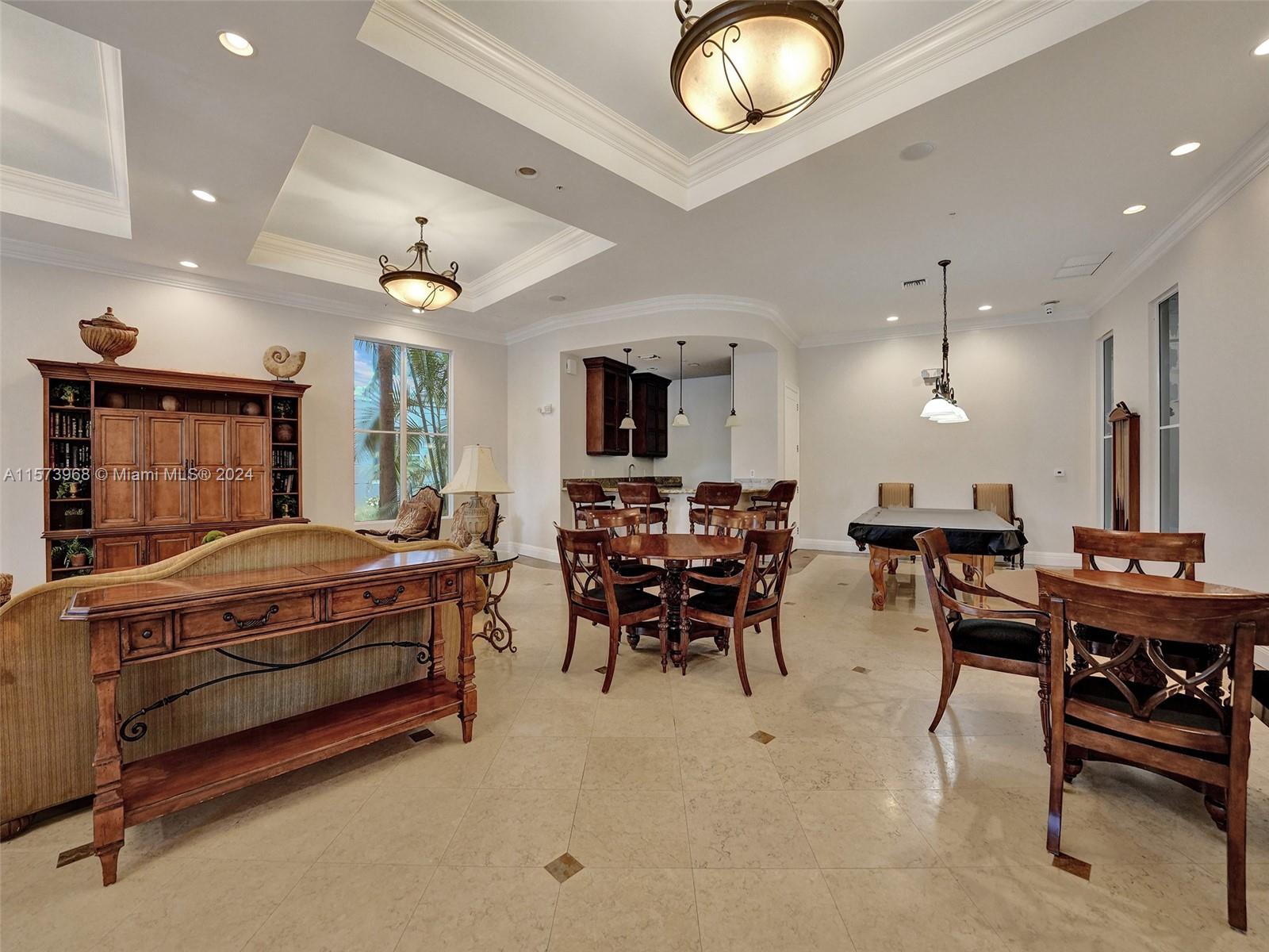 1660 Renaissance Commons Boulevard, Unit 2508 Boynton Beach, FL 33426 - Photo 22 of 28 a living room with furniture a clock and a ceiling fan