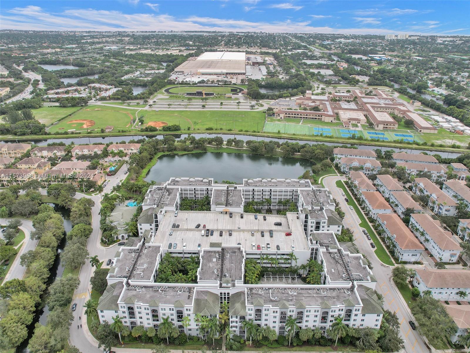 1660 Renaissance Commons Boulevard, Unit 2508 Boynton Beach, FL 33426 - Photo 23 of 28 an aerial view of residential houses with outdoor space and river