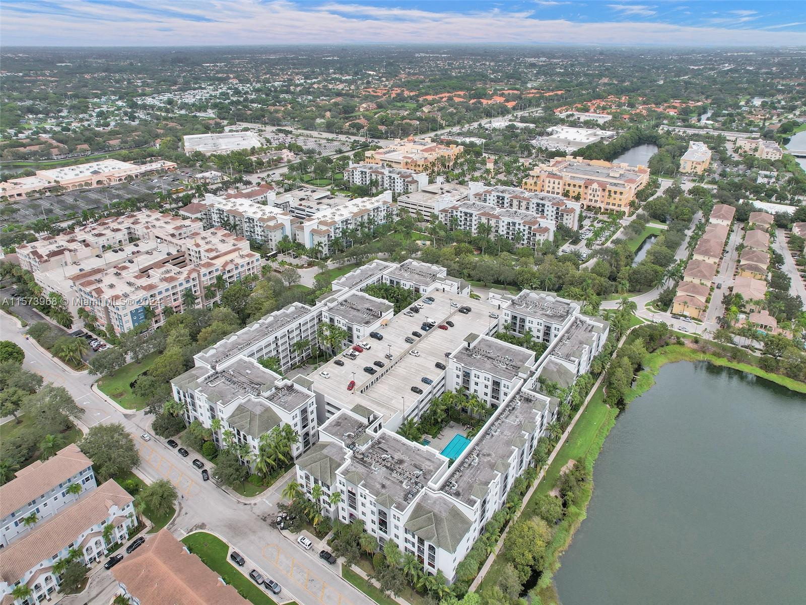 1660 Renaissance Commons Boulevard, Unit 2508 Boynton Beach, FL 33426 - Photo 24 of 28 an aerial view of a house with a lake