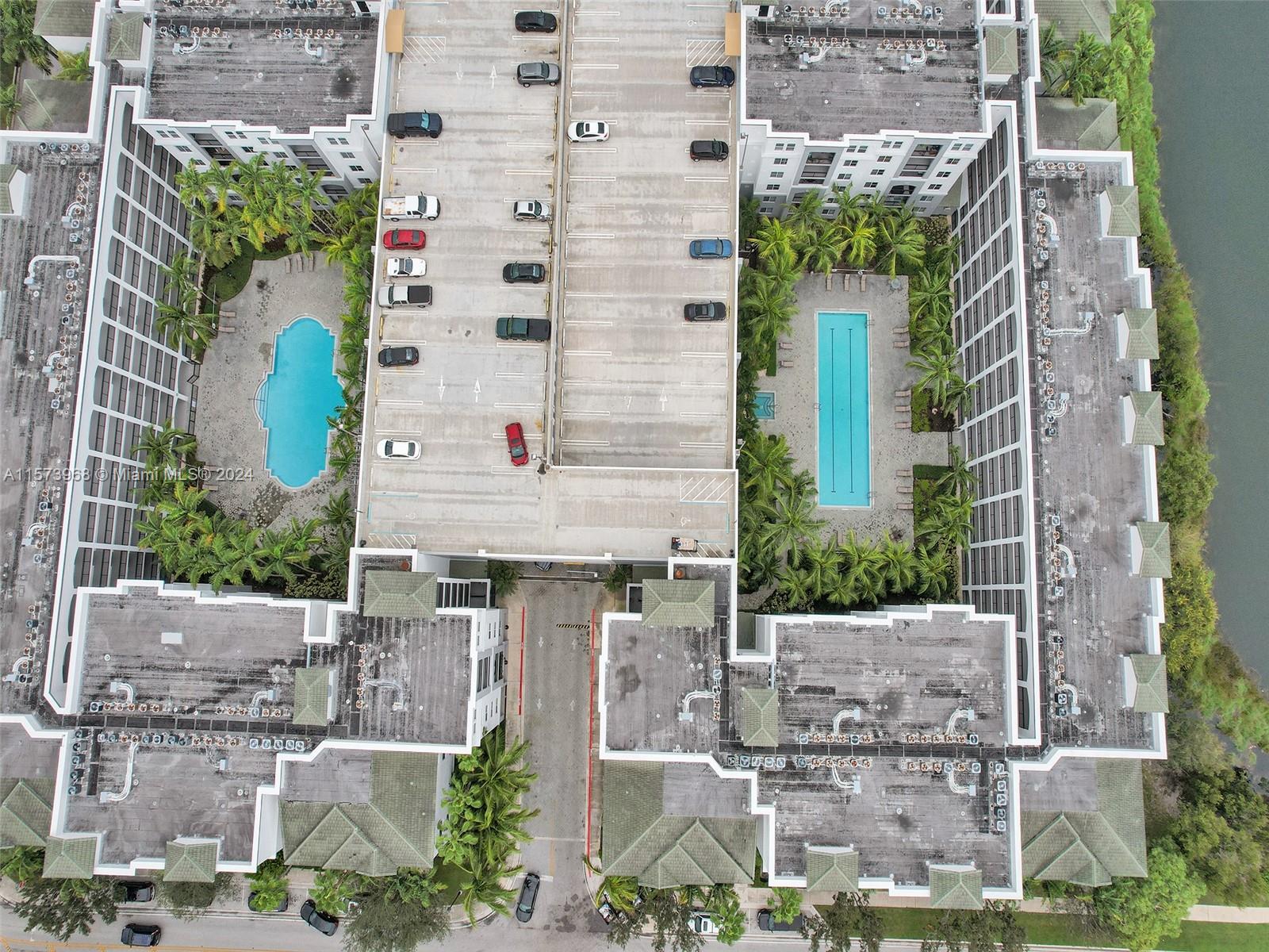 1660 Renaissance Commons Boulevard, Unit 2508 Boynton Beach, FL 33426 - Photo 26 of 28 an aerial view of a residential apartment building with a yard