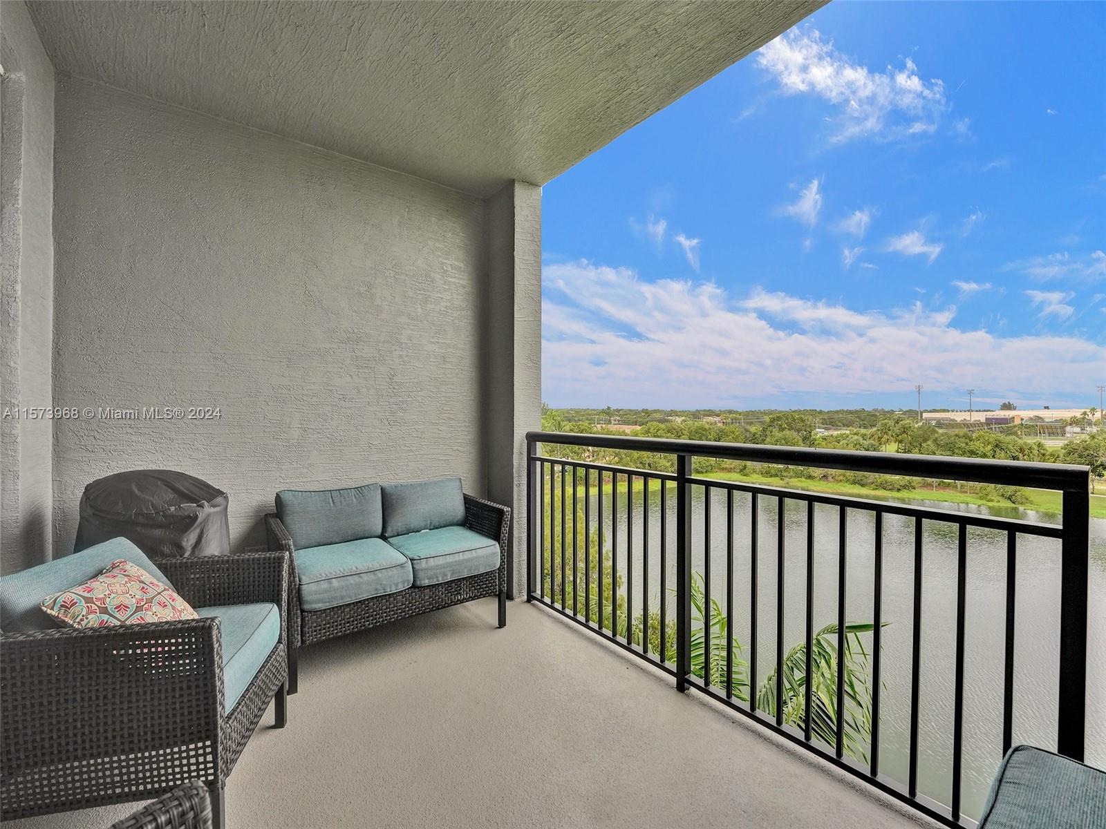 1660 Renaissance Commons Boulevard, Unit 2508 Boynton Beach, FL 33426 - Photo 3 of 28 a balcony with furniture and city view