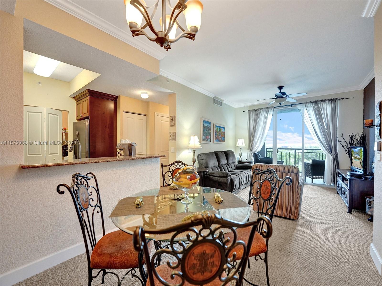 1660 Renaissance Commons Boulevard, Unit 2508 Boynton Beach, FL 33426 - Photo 10 of 28 a view of a dining room with furniture window and outside view