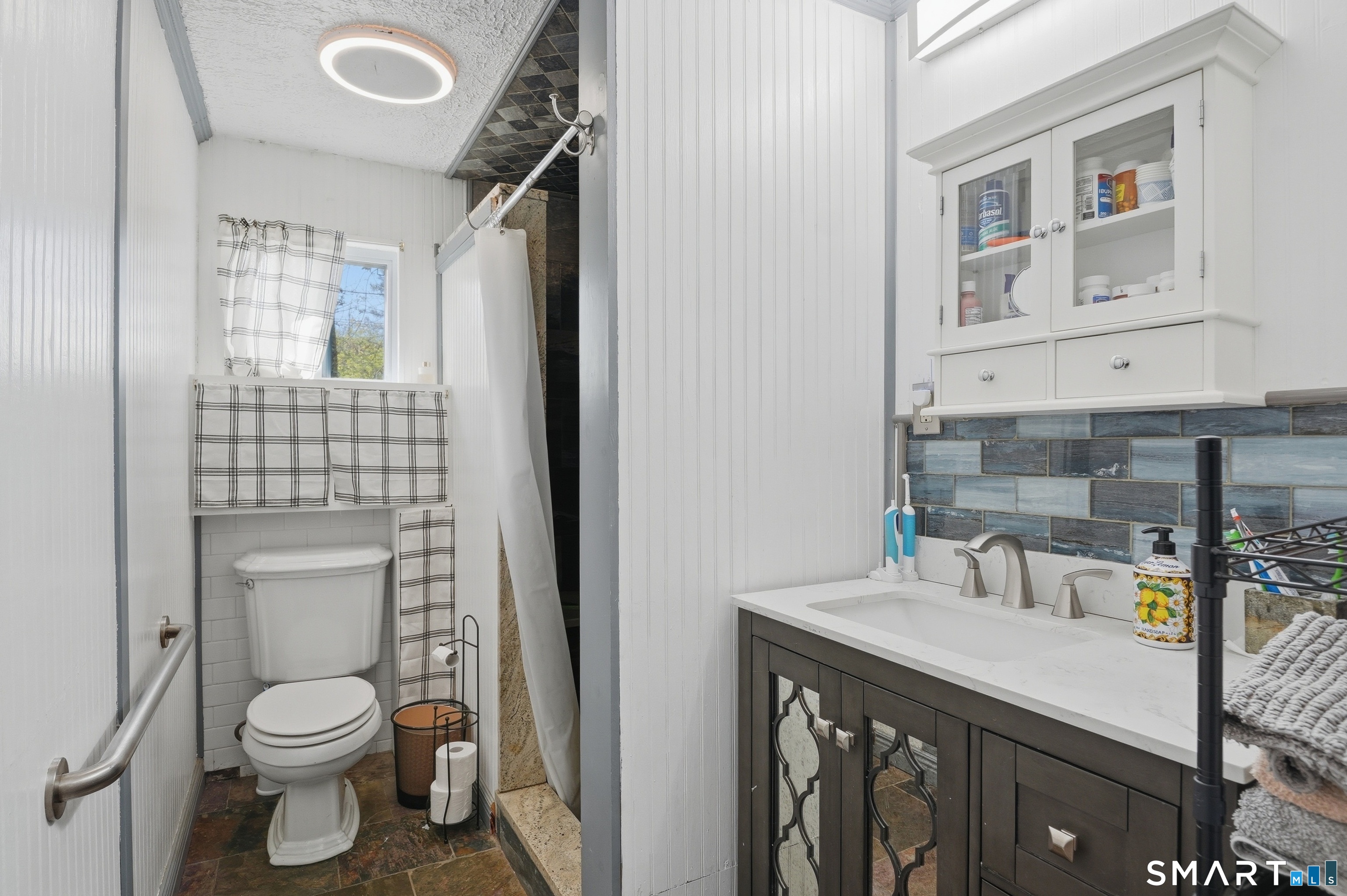 46 Pleasant Street Torrington, CT 06790 - Photo 12 of 40 a bathroom with a sink toilet and shower