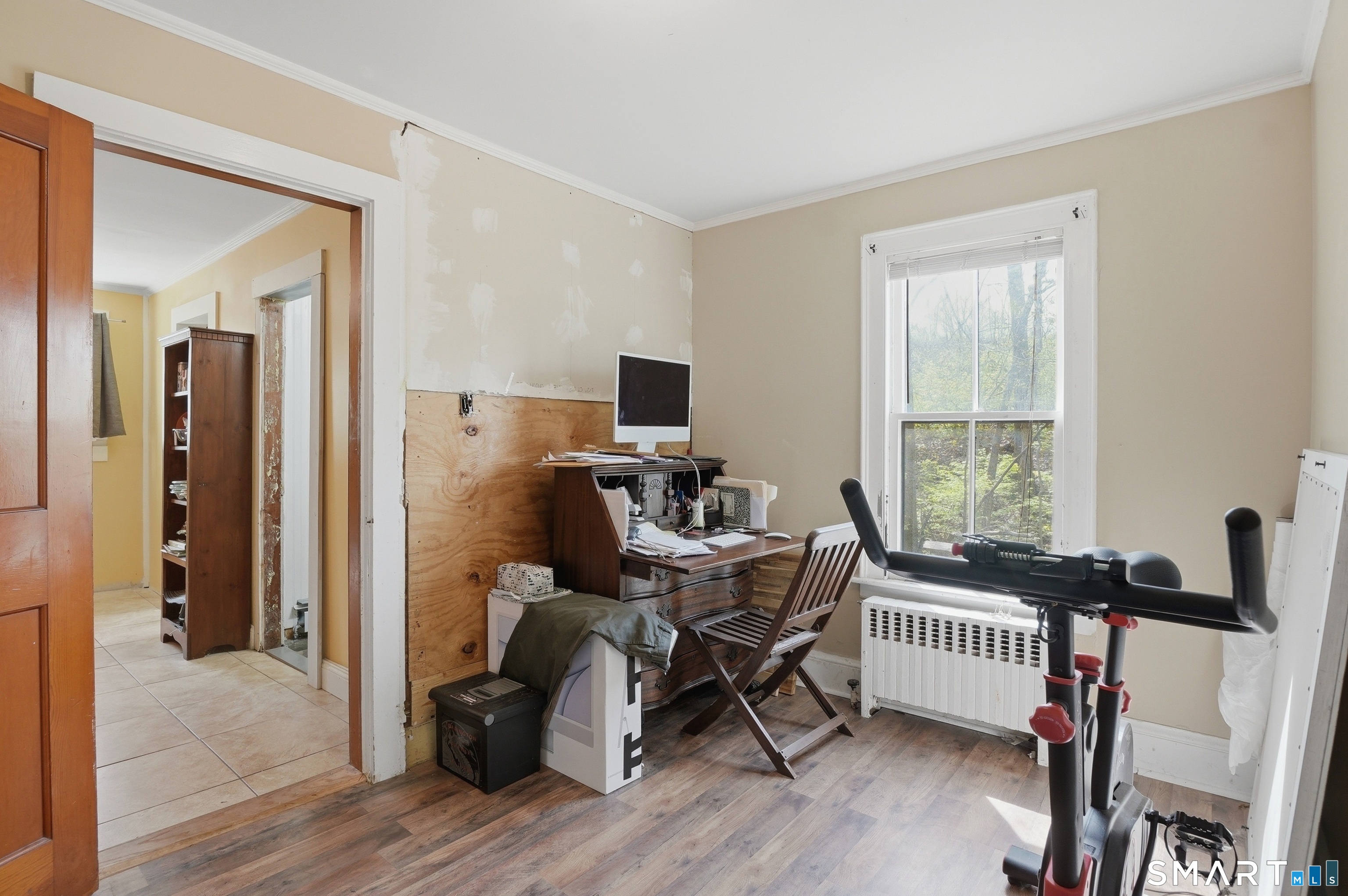 46 Pleasant Street Torrington, CT 06790 - Photo 14 of 40 a view of a workspace with furniture and a window