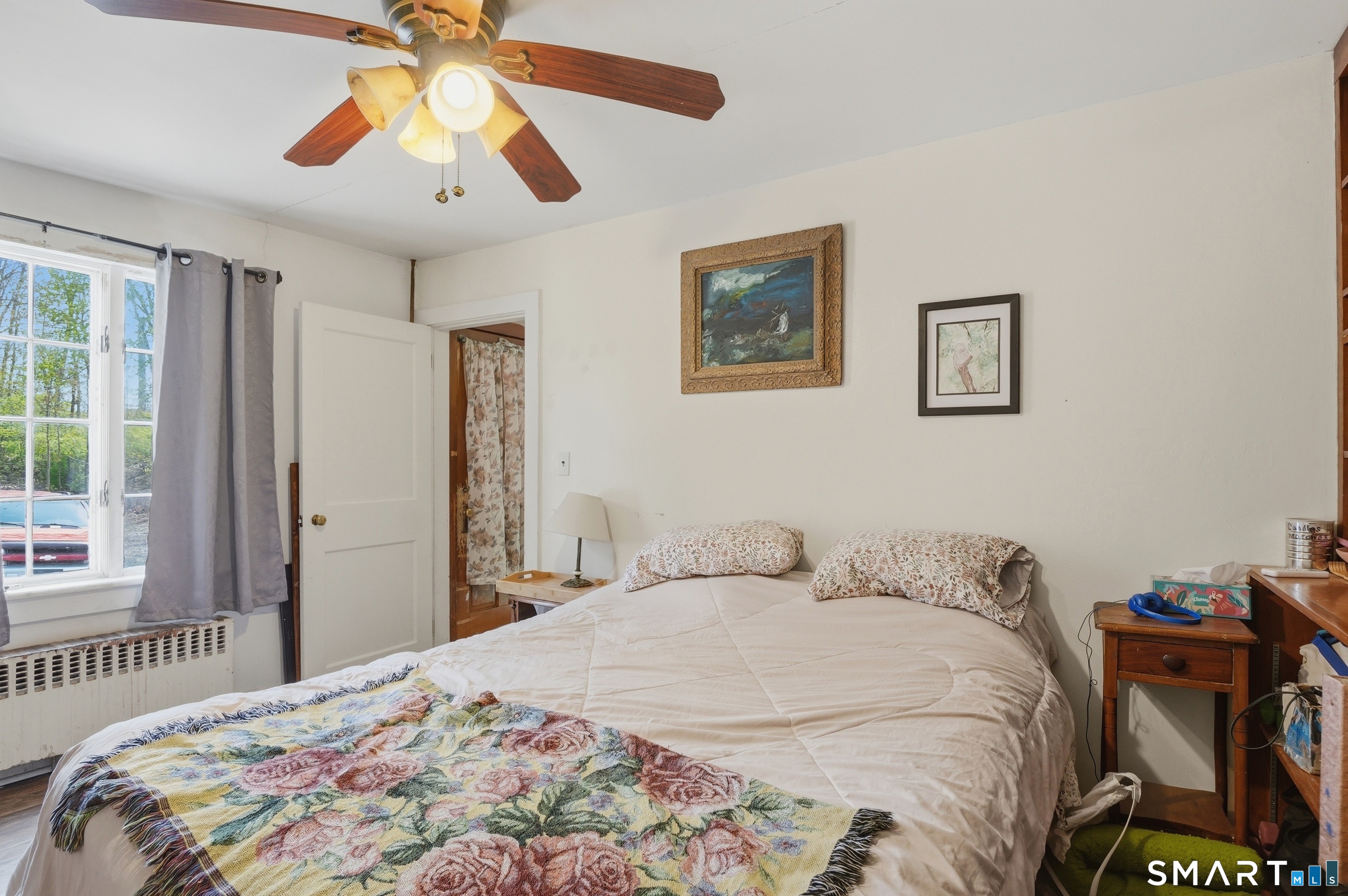 46 Pleasant Street Torrington, CT 06790 - Photo 19 of 40 a bedroom with a bed and a chandelier