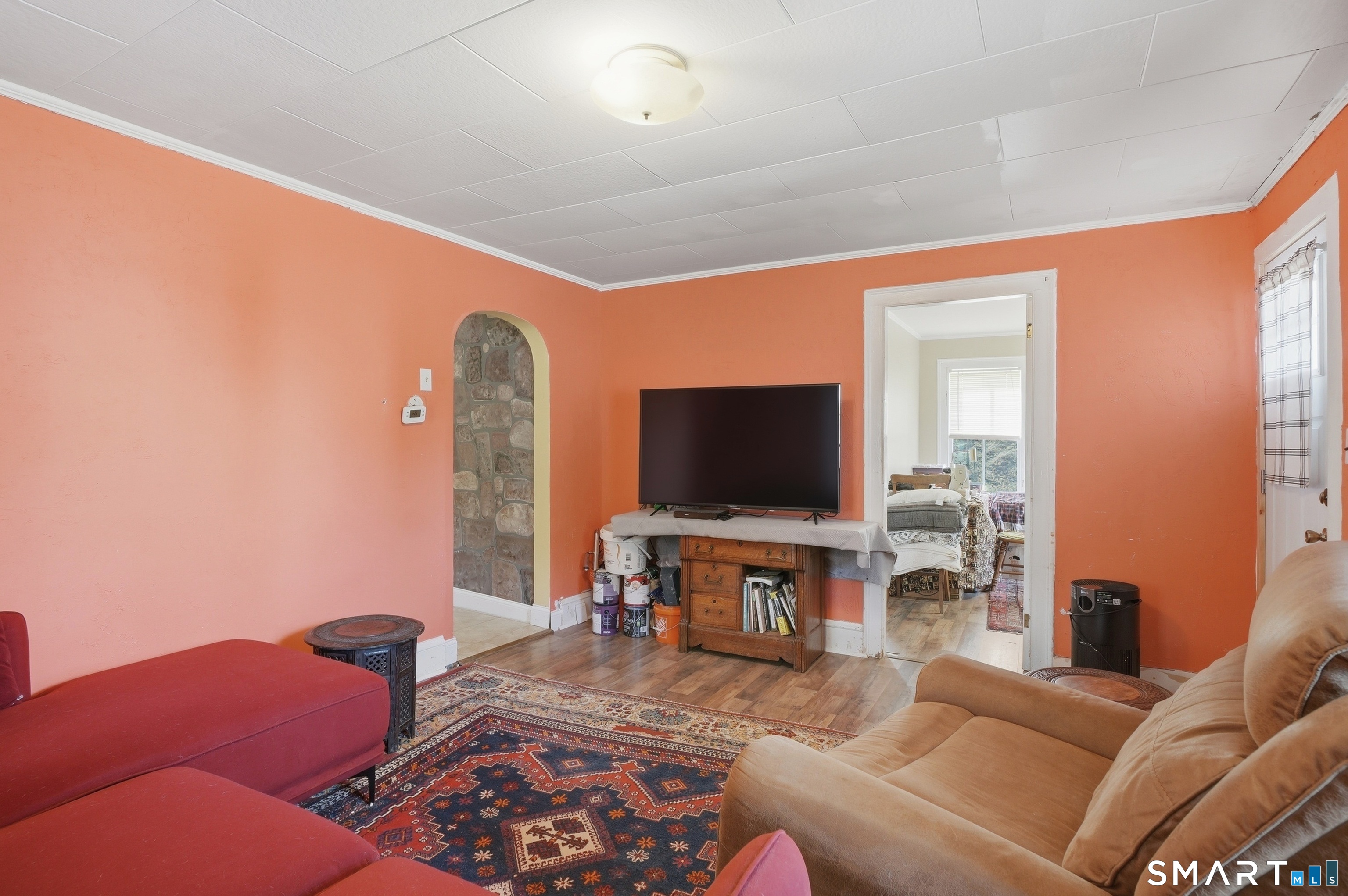 46 Pleasant Street Torrington, CT 06790 - Photo 24 of 40 a living room with furniture and a flat screen tv