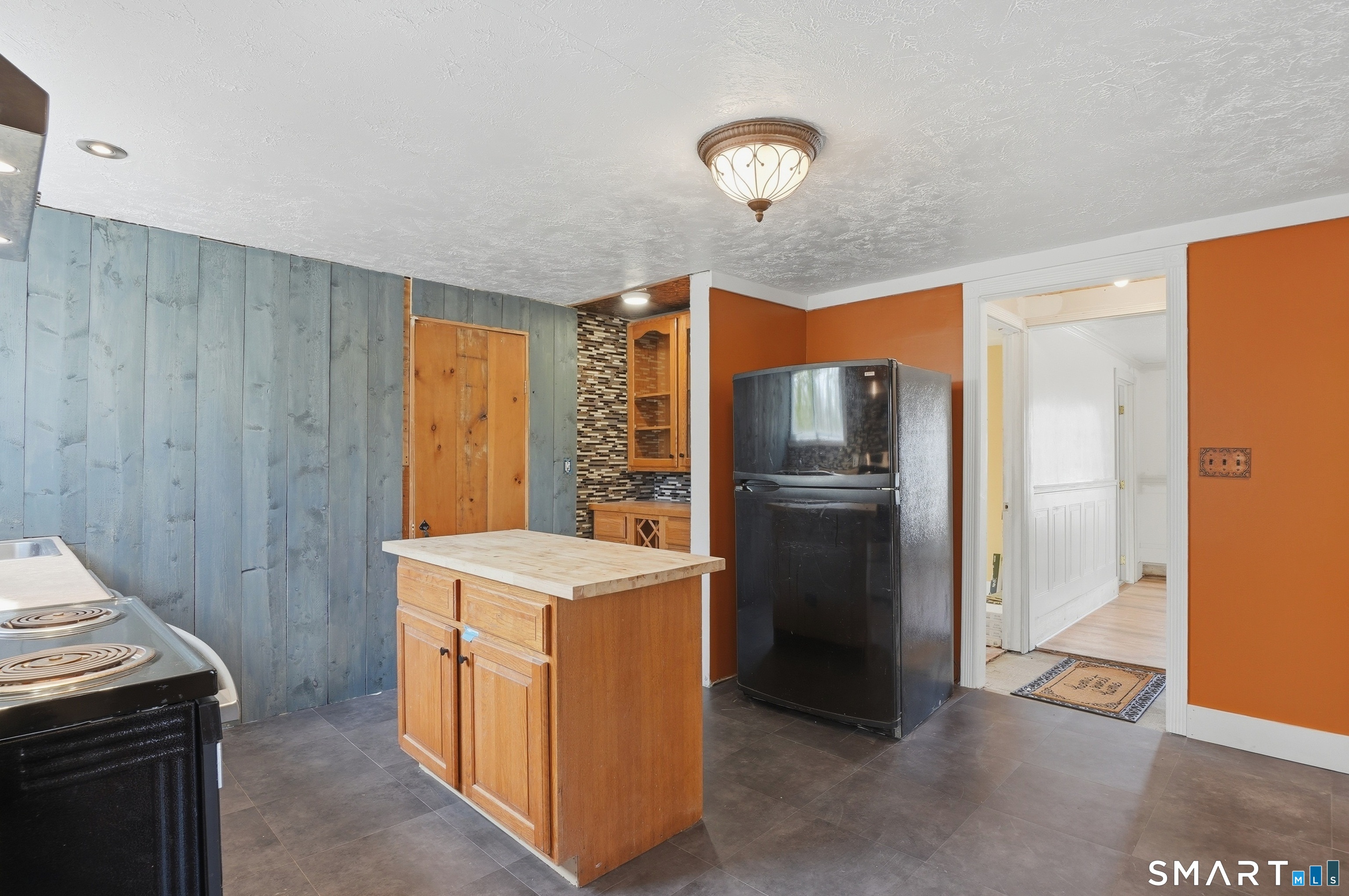 46 Pleasant Street Torrington, CT 06790 - Photo 26 of 40 a kitchen with a refrigerator sink and stove