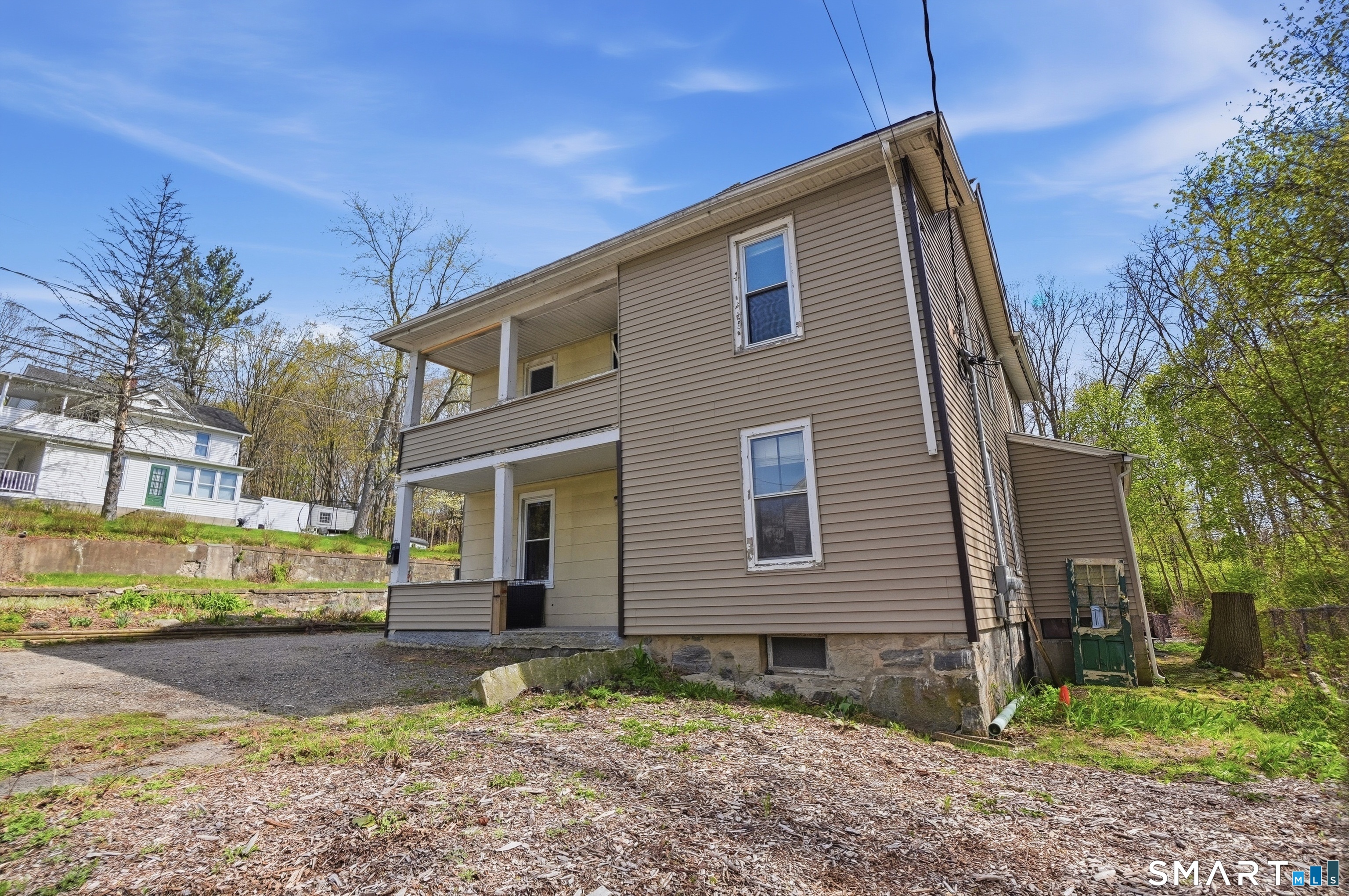 46 Pleasant Street Torrington, CT 06790 - Photo 3 of 40 a front view of a house with garden